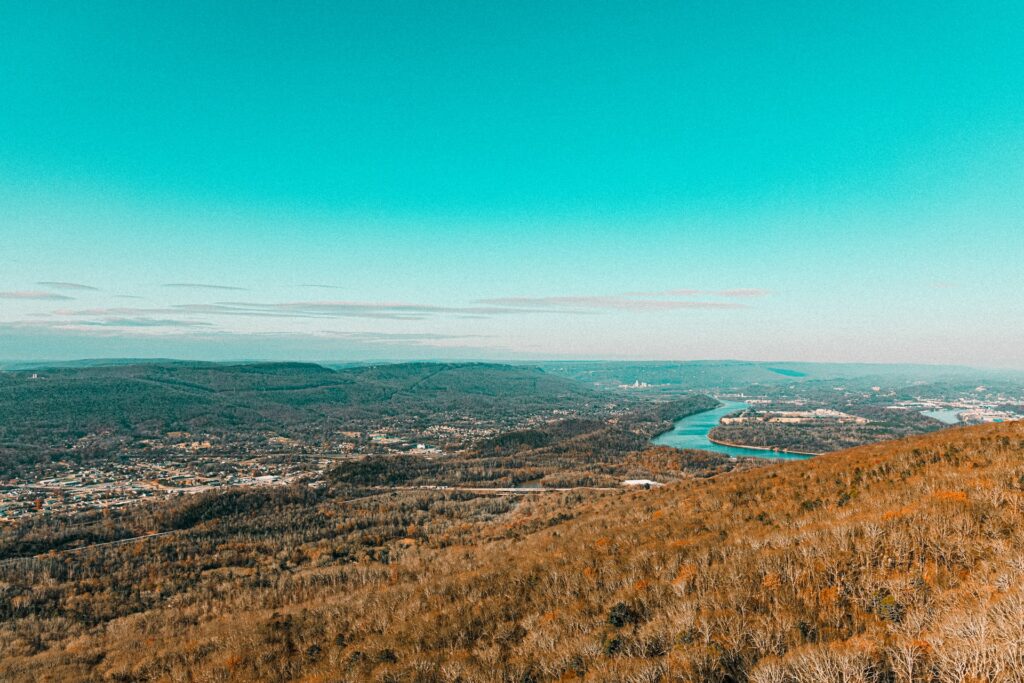 matthew-jungling-lYcMyyalInI-unsplash-1024x683 landscape with clear blue sky overlooking a river in distance