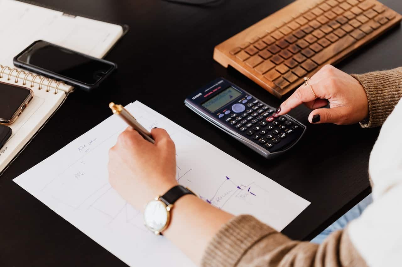 bookkeeper writing down on paper