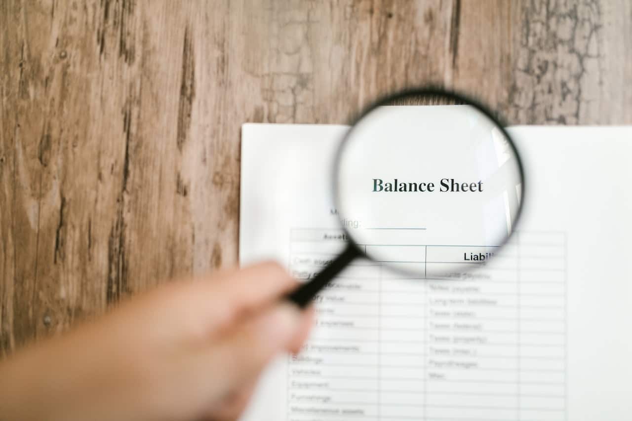 does land ever lose value? a man looking at a balance sheet